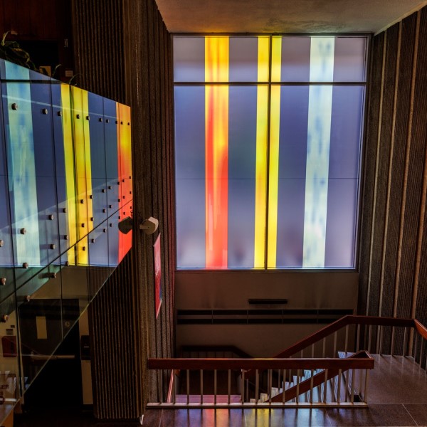photograph of art on windows from inside the Hall Building