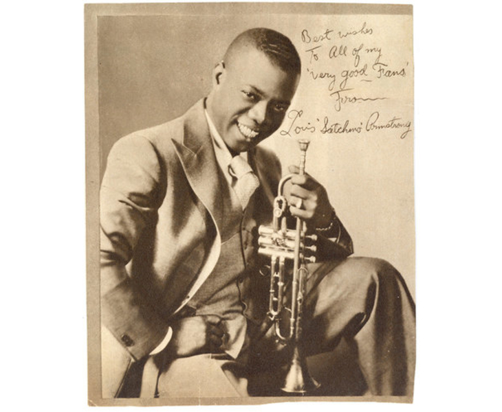 Annotated photograph of a cheery Louis Armstrong posing with trumpet